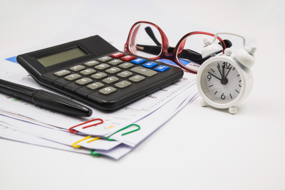 Calculator and tax documents on a desk
